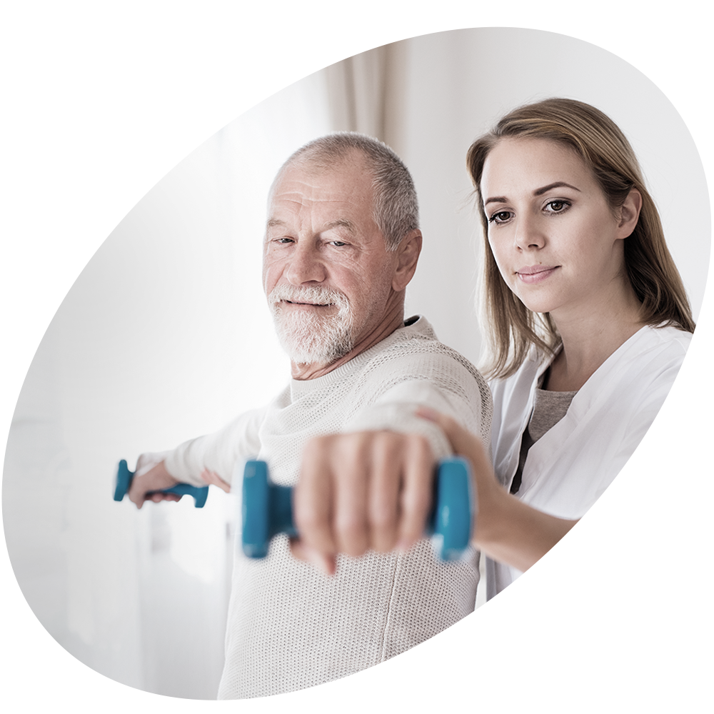 Healthcare professional helping elderly man with weights